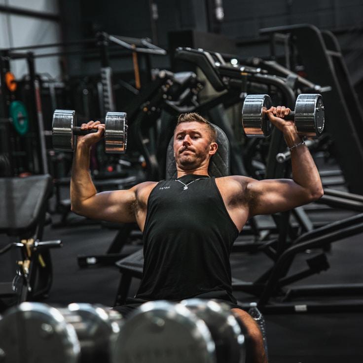 Women in a fitness class doing stretching and mobility exercises